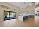Spacious kitchen with an oversized island, stainless steel appliances, and seamless access to the outdoor pool area at 12222 N 74Th St, Scottsdale, AZ 85260
