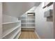 Organized walk-in pantry with ample shelving offers plenty of storage space for all your kitchen essentials at 12222 N 74Th St, Scottsdale, AZ 85260