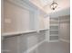 Walk in closet has shelves and cabinets for ample storage at 12222 N 74Th St, Scottsdale, AZ 85260