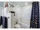 Neat and tidy bathroom features shower/tub combo and artful decor at 12222 N Paradise Village S Pkwy # 220, Phoenix, AZ 85032