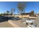 Outdoor community space with seating areas, modern tables, and lush landscaping at 12222 N Paradise Village S Pkwy # 220, Phoenix, AZ 85032