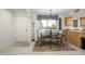 Inviting dining area with a large window offering natural light and a view of the neighborhood at 12222 N Paradise Village S Pkwy # 220, Phoenix, AZ 85032