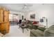 Cozy living room with balcony access, neutral decor, and comfortable seating arrangements at 12222 N Paradise Village S Pkwy # 220, Phoenix, AZ 85032
