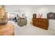 Comfortable living room with a ceiling fan, carpet, and a sliding glass door to a private balcony at 12222 N Paradise Village S Pkwy # 220, Phoenix, AZ 85032