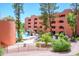 Attractive view of community pool area with landscaping and waterfalls at 12222 N Paradise Village S Pkwy # 220, Phoenix, AZ 85032