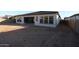 Expansive backyard featuring a covered patio, ready for landscaping and outdoor living at 12323 W Luxton Ln, Avondale, AZ 85323