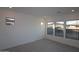 Bright bedroom with large windows offering plenty of natural light and hardwood floors at 12323 W Luxton Ln, Avondale, AZ 85323
