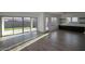 Open-concept living space with tile floors, lots of windows, and access to the backyard at 12324 W Parkway Ln, Avondale, AZ 85323