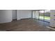 Spacious living room featuring tile floors and sliding glass doors to the backyard at 12324 W Parkway Ln, Avondale, AZ 85323