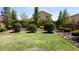 Lush backyard with healthy grass, decorative rock beds, and thriving greenery at 1309 W Park St, Phoenix, AZ 85041