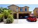 Inviting two-story home featuring a two car garage and manicured lawn at 1309 W Park St, Phoenix, AZ 85041