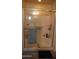 Tiled shower featuring sliding glass doors and built-in corner shelves at 1309 W Park St, Phoenix, AZ 85041
