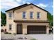 Stunning two-story home with a brown stucco finish and a two-car garage at 13282 E Verbina Ln, Florence, AZ 85132