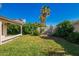 Lush backyard featuring mature landscaping, patio, and ample space for outdoor activities and relaxation at 15014 N 48Th Pl, Scottsdale, AZ 85254