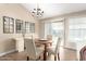 Cozy dining area with a stylish chandelier and a view of the backyard at 15014 N 48Th Pl, Scottsdale, AZ 85254