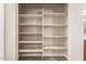 Linen closet with multiple shelves for storing towels and linens at 15014 N 48Th Pl, Scottsdale, AZ 85254
