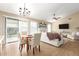 Combined living and dining area with wood floors and ample natural light at 15014 N 48Th Pl, Scottsdale, AZ 85254