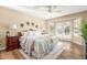 Serene main bedroom featuring wood floors, neutral decor, and French doors at 15014 N 48Th Pl, Scottsdale, AZ 85254