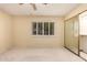 Bedroom with neutral carpet, white walls and white-shuttered window at 160 Leisure World -- # 160, Mesa, AZ 85206