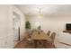 Elegant dining room with a wooden table and chairs, perfect for Gathering meals and entertaining at 160 Leisure World -- # 160, Mesa, AZ 85206