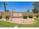 Stone community entrance sign with mature landscaping and rock ground cover at 160 Leisure World -- # 160, Mesa, AZ 85206