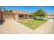 Well-maintained single-story home with attached garage, lawn, and mature landscaping under a clear blue sky at 160 Leisure World -- # 160, Mesa, AZ 85206