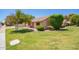 Single-story home featuring a well-manicured lawn, mature shrubs, and a charming tree at 160 Leisure World -- # 160, Mesa, AZ 85206