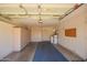 Two car garage with built in storage cabinets, epoxy flooring, and water heater at 160 Leisure World -- # 160, Mesa, AZ 85206
