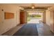Attached garage with door open displaying the 2 car capacity and epoxy flooring at 160 Leisure World -- # 160, Mesa, AZ 85206