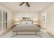 Serene bedroom with a queen-size bed, soft lighting, and a view into the ensuite bathroom at 160 Leisure World -- # 160, Mesa, AZ 85206