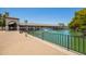 Scenic view of a community pond with a fountain, walking path, and lush landscaping surrounding the area at 160 Leisure World -- # 160, Mesa, AZ 85206