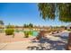 A tranquil pond with a small bridge, lush greenery, and desert plants enhancing the community's outdoor space at 160 Leisure World -- # 160, Mesa, AZ 85206