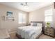 This bedroom has a decorative chandelier and a picture hanging above the bed at 1713 E Bridgeport Pkwy, Gilbert, AZ 85295