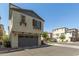 Charming two-story home featuring a gray garage door, complemented by neat landscaping, in a desirable neighborhood at 1713 E Bridgeport Pkwy, Gilbert, AZ 85295