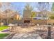 A beautiful stone fireplace offers an inviting outdoor space for gatherings and relaxation at 1713 E Bridgeport Pkwy, Gilbert, AZ 85295