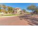 A stunning front gate with a manicured lawn welcomes residents and visitors at 1713 E Bridgeport Pkwy, Gilbert, AZ 85295