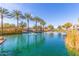 A sparkling community pond features palm trees and fountains at 1713 E Bridgeport Pkwy, Gilbert, AZ 85295