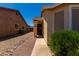 Front entrance to this single story home with desert landscaping at 1719 E Sandalwood Rd, Casa Grande, AZ 85122