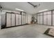 Spacious garage with epoxy floors and ample storage cabinets along the walls at 1719 E Sandalwood Rd, Casa Grande, AZ 85122
