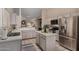 Kitchen features white cabinets and stainless steel appliances at 1719 E Sandalwood Rd, Casa Grande, AZ 85122