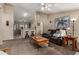 Bright living room featuring neutral paint, ceiling fan, and comfortable seating at 1719 E Sandalwood Rd, Casa Grande, AZ 85122