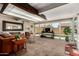 Open living space with natural light and an inviting backyard swimming pool just outside at 1719 E Sandalwood Rd, Casa Grande, AZ 85122