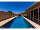 Long swimming pool in backyard featuring clean water and privacy at 1719 E Sandalwood Rd, Casa Grande, AZ 85122