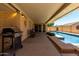 Covered patio adjacent to a sparkling swimming pool, creating a relaxing outdoor space at 1719 E Sandalwood Rd, Casa Grande, AZ 85122