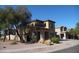 Two-story home featuring arched entry, desert landscaping, and a Spanish-tile roof at 18548 W Sunbelt Dr, Surprise, AZ 85374