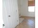 Laundry room with tile flooring, a utility sink connection, and a window at 18548 W Sunbelt Dr, Surprise, AZ 85374