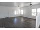 Spacious living room with light gray flooring, neutral walls, and plenty of natural light at 18548 W Sunbelt Dr, Surprise, AZ 85374