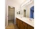 Bathroom with double sinks, walk in closet at 1902 N 106Th Ave, Avondale, AZ 85392