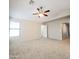 Bedroom featuring carpet, a ceiling fan and natural light at 1902 N 106Th Ave, Avondale, AZ 85392