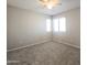 Bedroom featuring carpeted floors, natural lighting, and a ceiling fan at 1902 N 106Th Ave, Avondale, AZ 85392